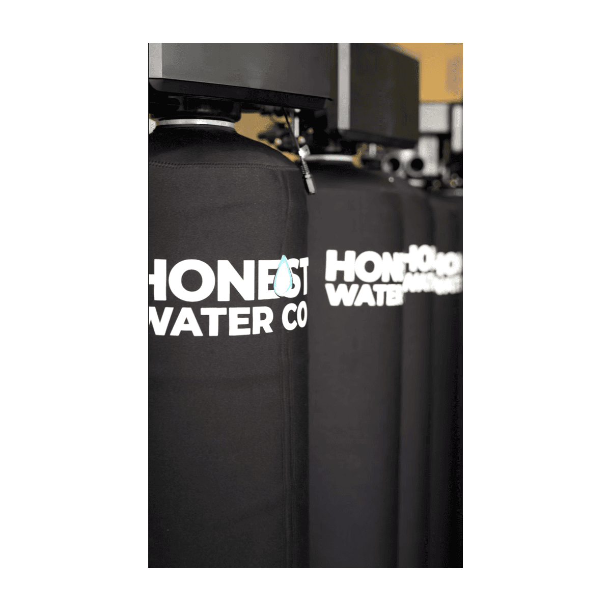 Honest Water Co branded tanks installed in a customer garage